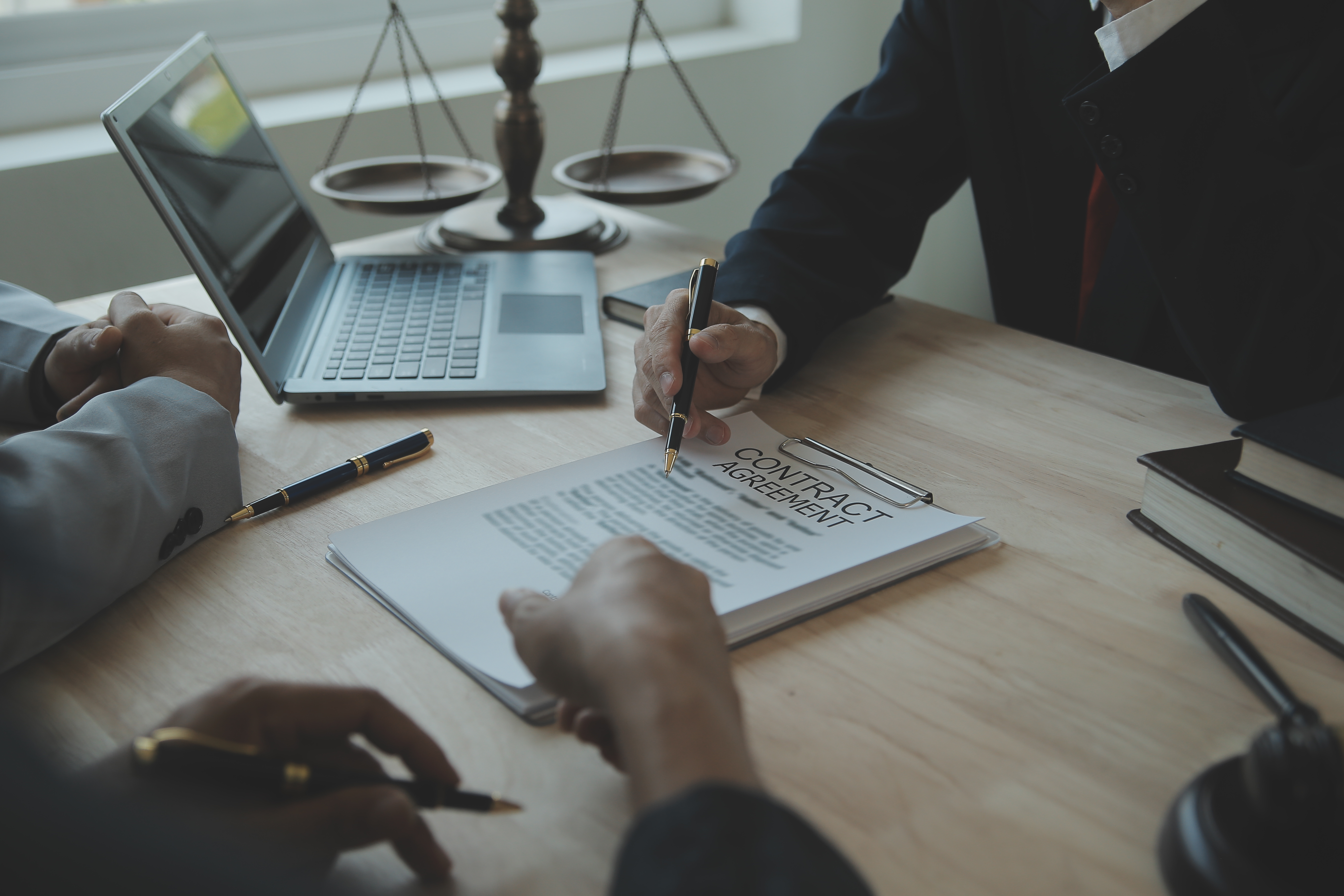 A legal consultation showing a person receiving guidance